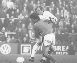 Peter Spiring challenged by Bobby Moore
