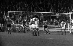 Keith Barber gather the ball with Ron Futcher looking on