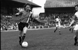Andy King driving in field