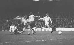 Alan West tries to get on the end of a pass from Jimmy Husband