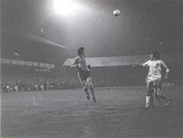 Brian Chambers heads over a cross