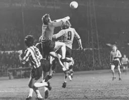 Ron Futcher pressurises the Saints defence