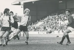 Andy King and Ron Futcher fail to make contact with the ball