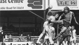 Ron Futcher bravely heads in the first Luton goal