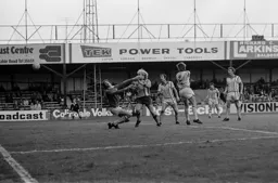 Ron Futcher watches Colin Barrett put into his own net