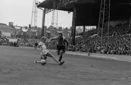 John Aston skips past his marker