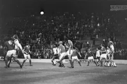 Ricky Hill in a packed penalty area