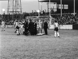 Keith Barber receives treatment for a broken rib before having to go off