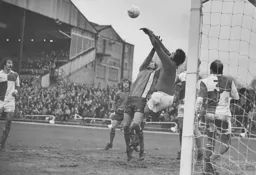 Ron Futcher battles with Rovers goalkeeper Jim Eadie