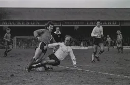 Brian Chambers has his legs taken from under him