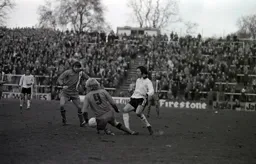 Ron Futcher and Alan West converge on a Fulham player