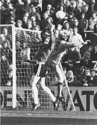 Ron Futcher challenges for the ball