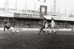 Jimmy Husband has his shot saved by the Wanderers keepers legs