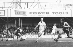 Jimmy Husband watches the ball flash wide
