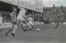 John Aston tackles by the corner flag