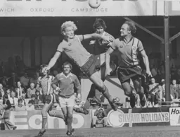 Paul Futcher and John Faulkner attack the same ball
