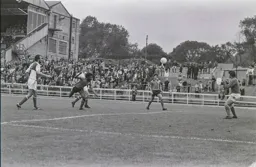 Ricky Hill gets a flying header in