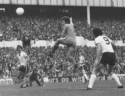 Jimmy Husband puts a header over