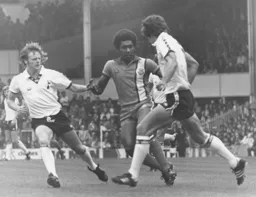 Ricky Hill tries to win the midfield battle