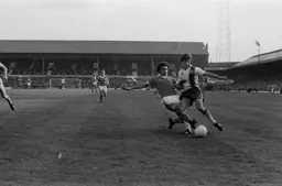 Phil Boersma has the ball taken off his foot