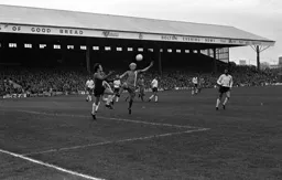 Ron Futcher challenges the Wanderers keeper