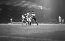 Gary Heale leans into the City defender trying to get to the ball first