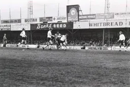 Ricky Hill fights his way to the ball