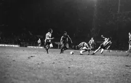 Ricky Hill gets away from three defenders