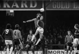 John Faulkner wins the header