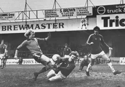 Ron Futcher sees an effort blocked by the goalkeeper