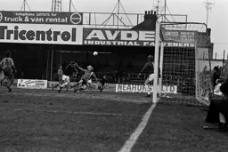 Ron Futcher cannot direct the header towards goal