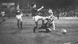 Ron Futcher is beaten to the ball by Millwall's Tony Hazell