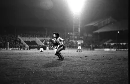 Ricky Hill tries to pass the Millwall defender