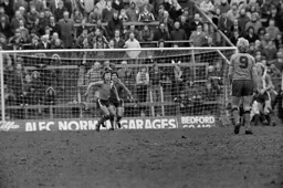 Paul Price comes to clear the ball in front of his keeper