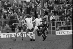 Ricky Hill gets caught up in midfield