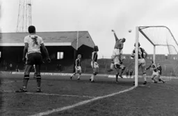 Brian Stein watches on as the keeper tips the ball over the bar