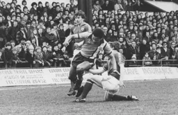 Brian Stein tries to get round the Sunderland defence