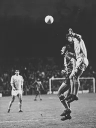Bob Hatton is beaten to the ball