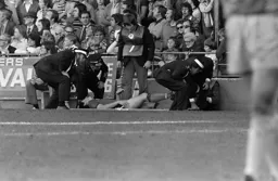 Mark Aizlewood taken off on a stretcher