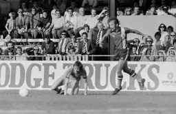 Bob Hatton races for the ball