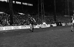 Alan West gets on a cross in front of Main Stand crowd