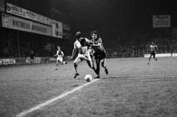 Steve Taylor trying to get round the defender