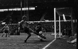 Paul Price has his effort blocked
