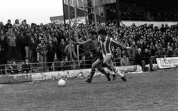 Bob Hatton holding off the defender