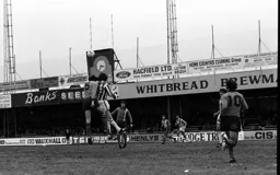Chris Turner competes with United defender