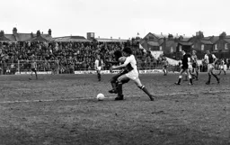 Ricky Hill holding off Rovers defender