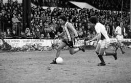 Barry Silkman taking on the defender