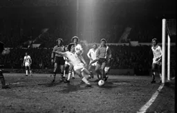 Steve Taylor watches defender clear the ball