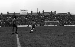 Alan West crosses into the box