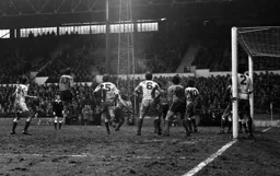 Bob Hatton gets a header in a crowded area